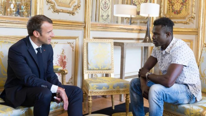 Mamoudou Gassama with President Macron at the Élysée Palace after his heroic climb up a block of flats THIBAULT CAMUS/AP